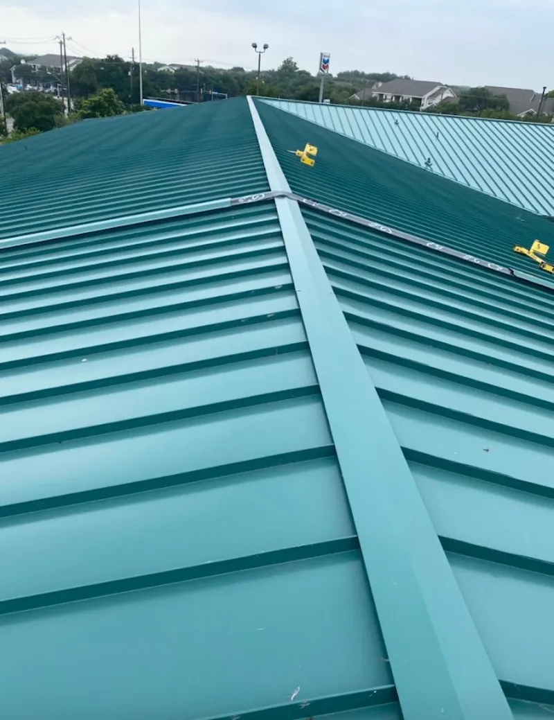 Green commercial metal roof ridge and valley for Metal Roof Repair in Shady Hollow